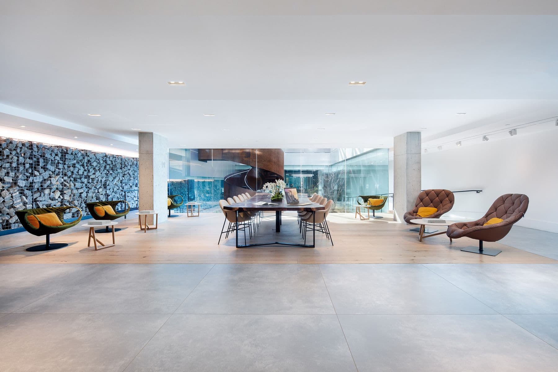 420 Kent - Straight on view of Quiet lounge with conference table and chairs, side seating with small tables, wood floors, modern and bright