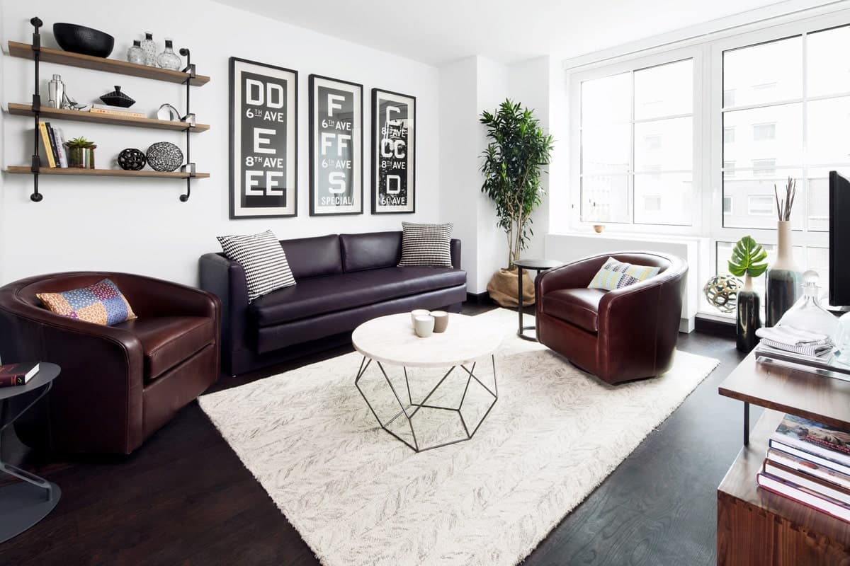 Living room with couch and dark wood flooring