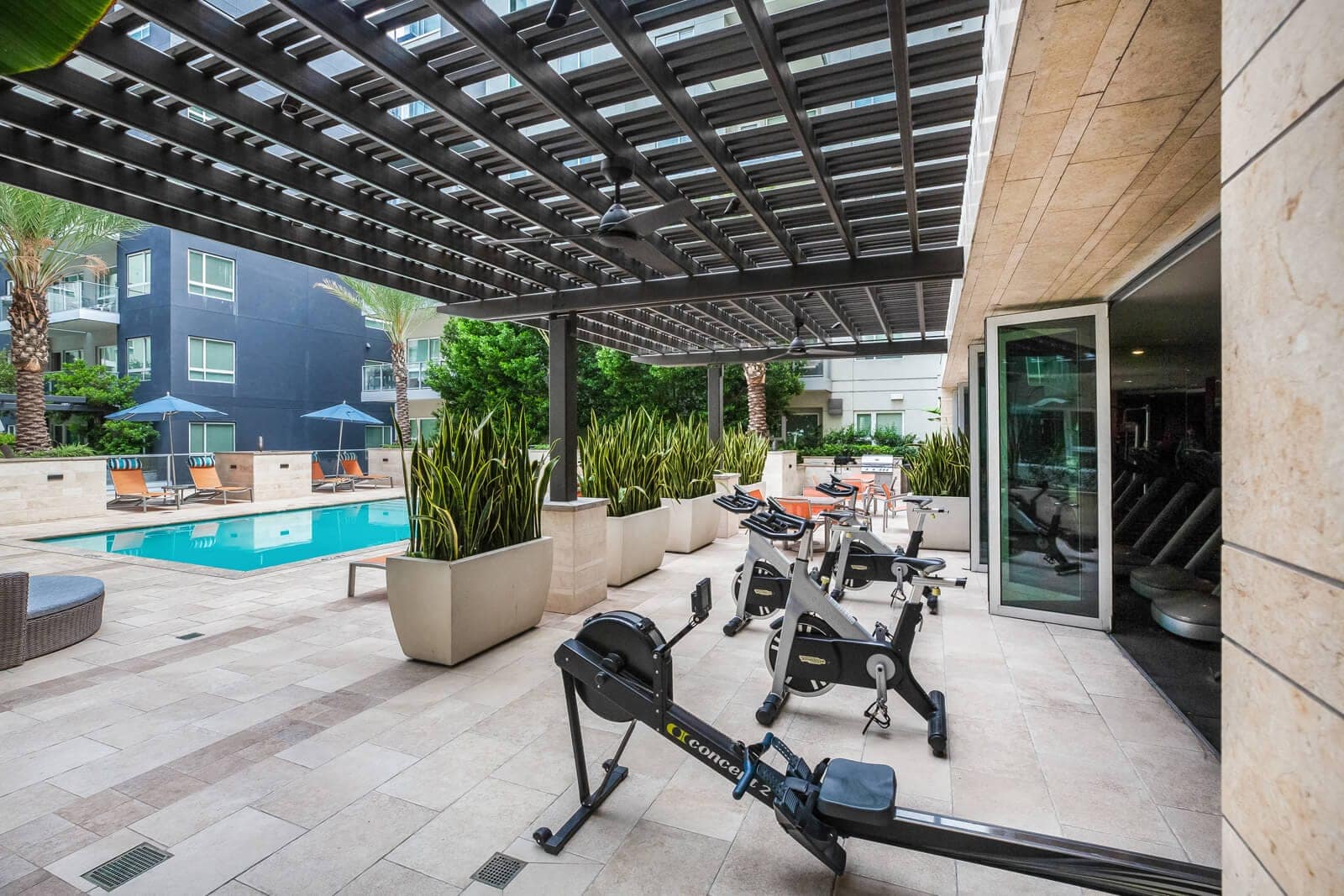 Spin bikes with a pool view