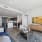 Spacious living room and kitchen with skyline views