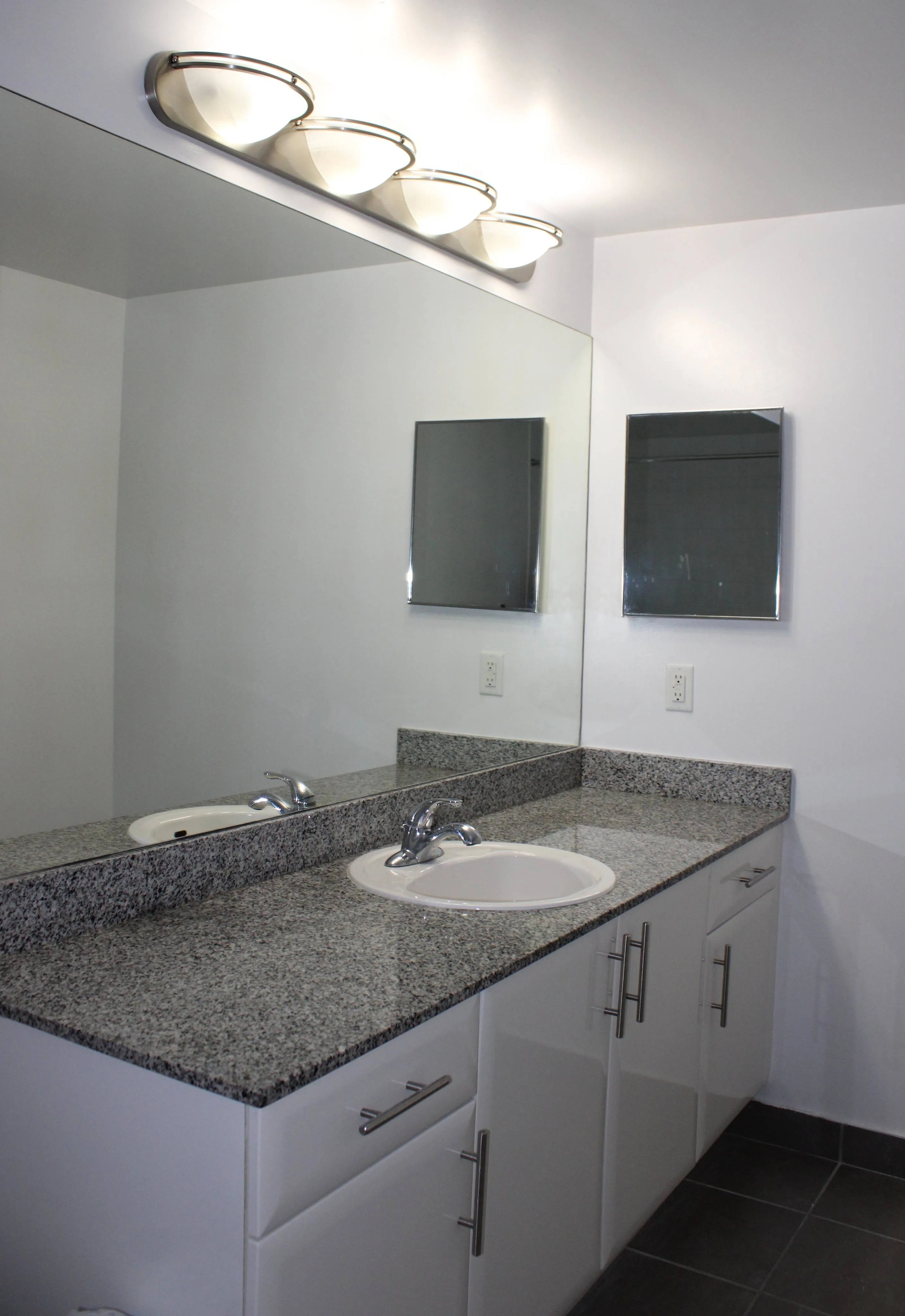 Exotic Marble Vanity Tops and Italian Slate Floors in Bathrooms