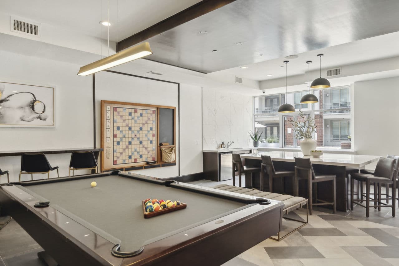 clubhouse game room at Alara Uptown Apartments
