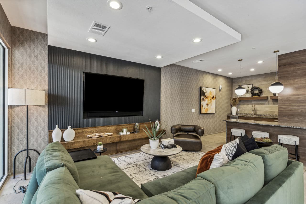Clubhouse featuring modern design and cozy seating at Gallery at Turtle Creek Apartments