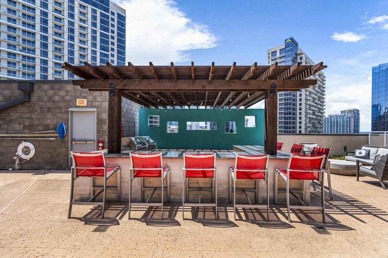 Outdoor grill area with modern patio furniture
