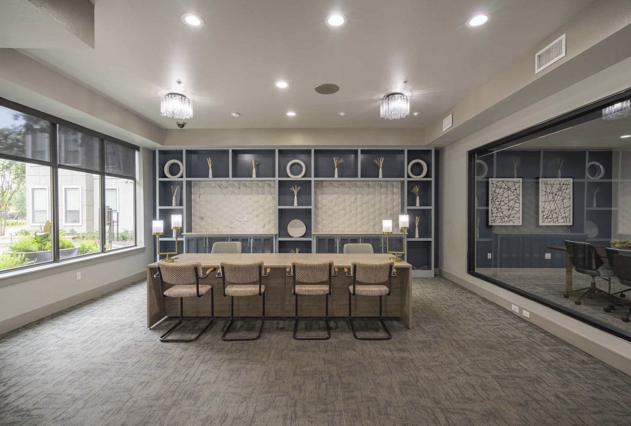 Clubhouse featuring modern decor and seating areas at Seville Uptown Apartments