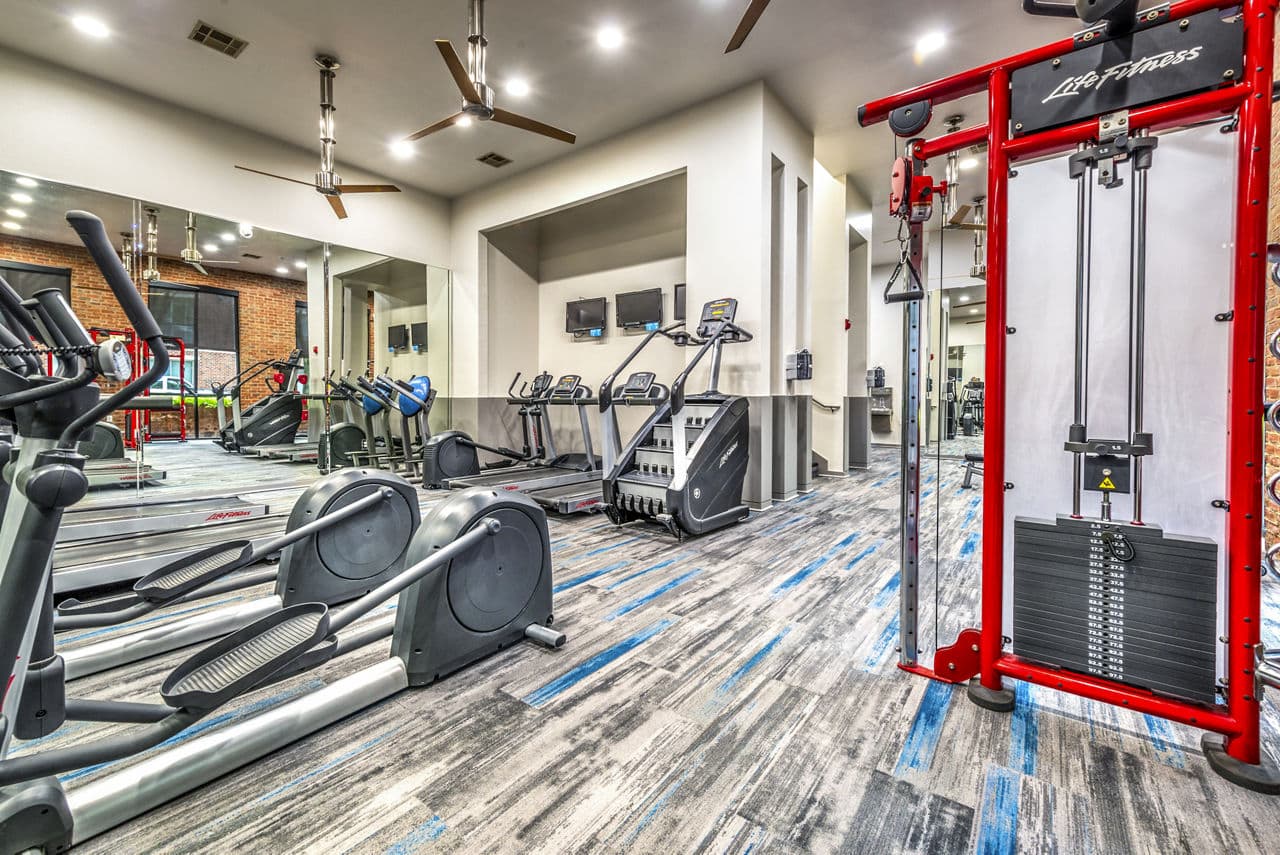 State-of-the-art fitness center with modern equipment at Manchester State Thomas Apartments