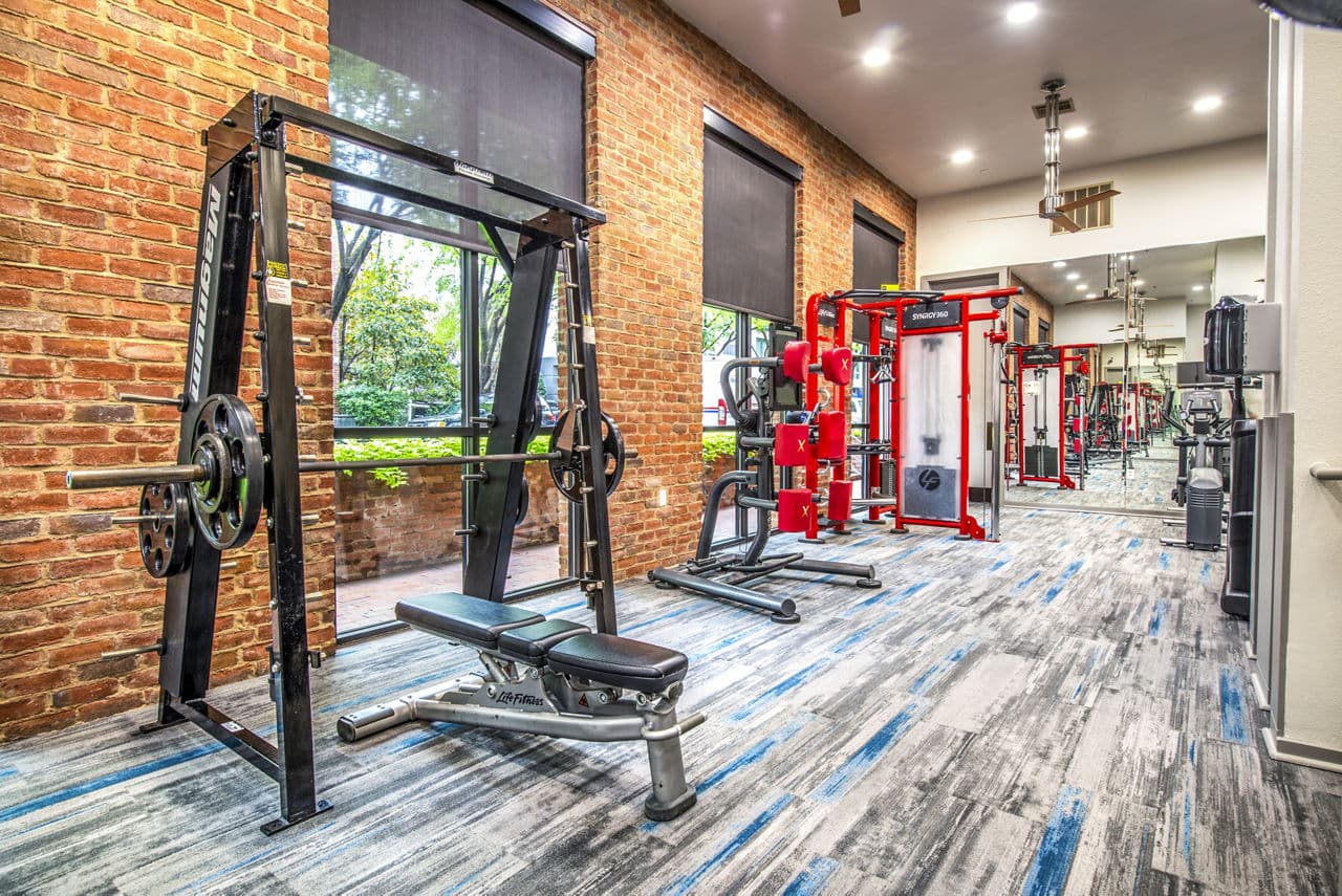 Modern fitness center with cutting-edge equipment at Manchester State Thomas Apartments