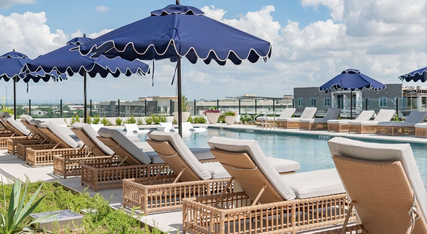 Pool with loungers at Solomon luxury apartments in Mueller, Austin, TX