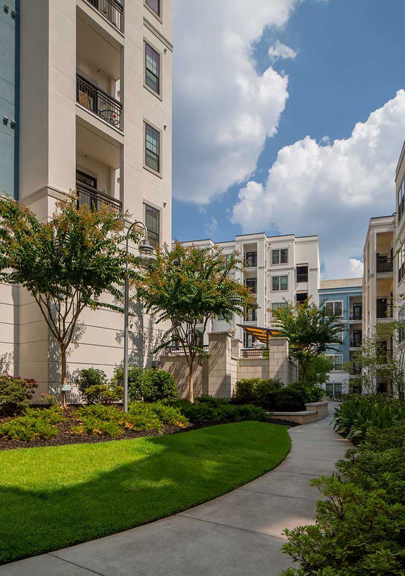 Community building with walkway amongst landscaping
