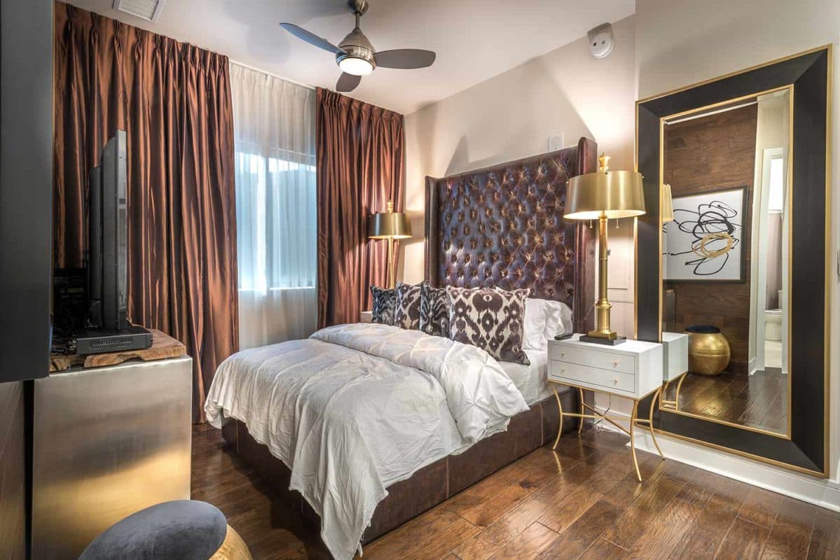 Guest suite bedroom with hardwood-inspired flooring