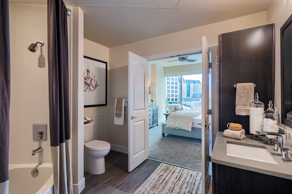 Bathroom with soaking tub and tile flooring