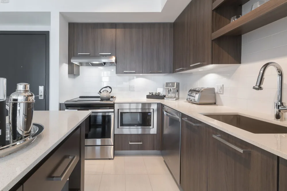 Kitchen with stainless steel appliances at Solitair Brickell Apartments in Miami, Florida