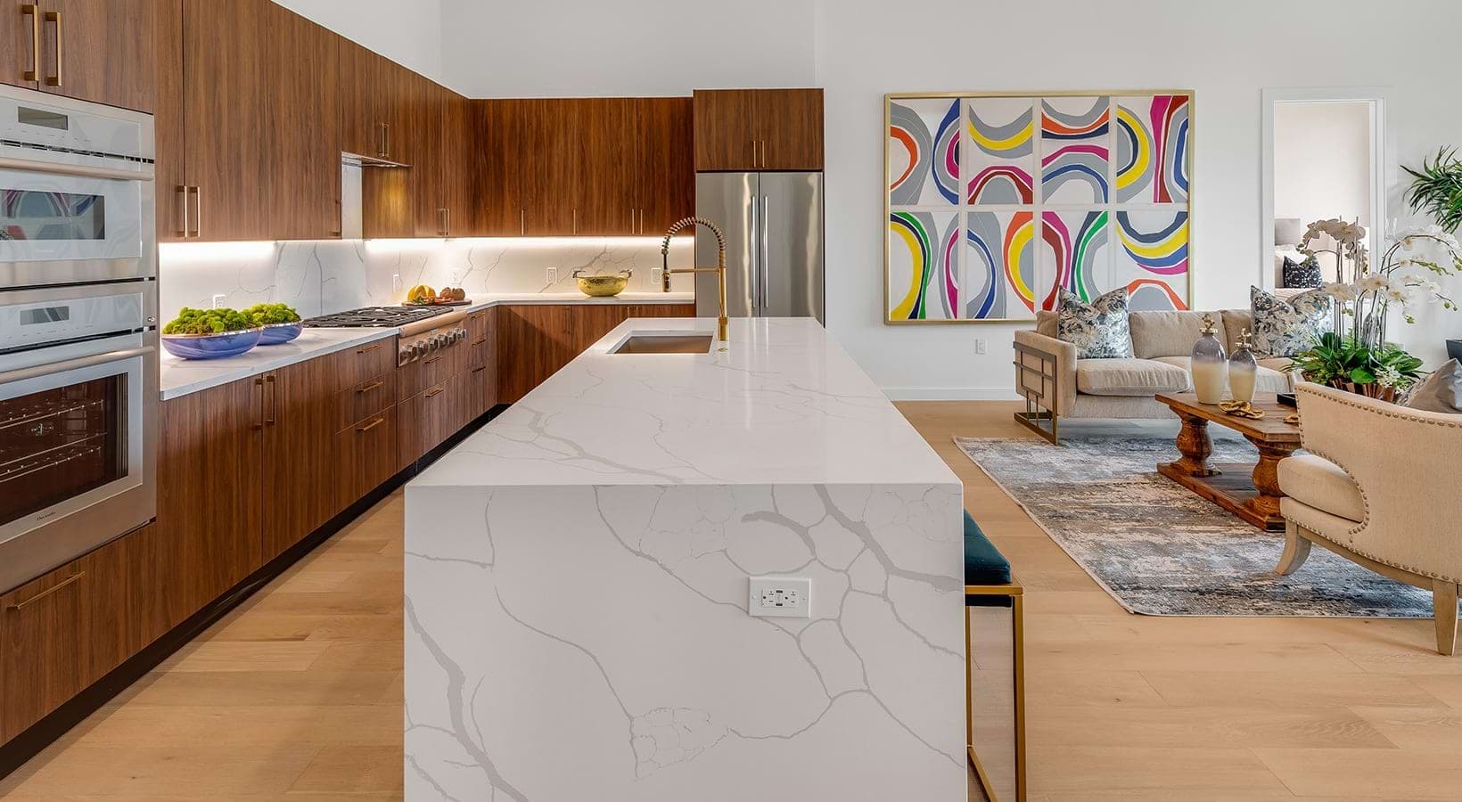 Kitchen with upgraded Moen faucets and fixtures, elevated Thermador appliances with double-oven combo, and imported Italian cabinetry