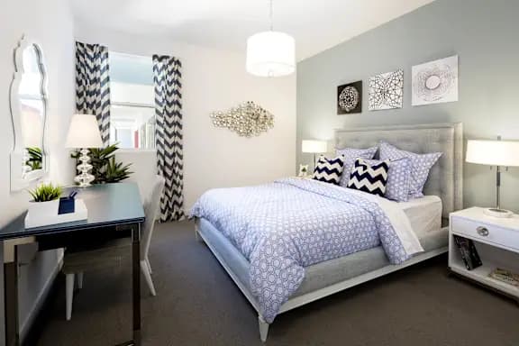 Bedroom with upholstered bed and chevron curtains at Domain WeHo Apartments, Santa Monica, 90404