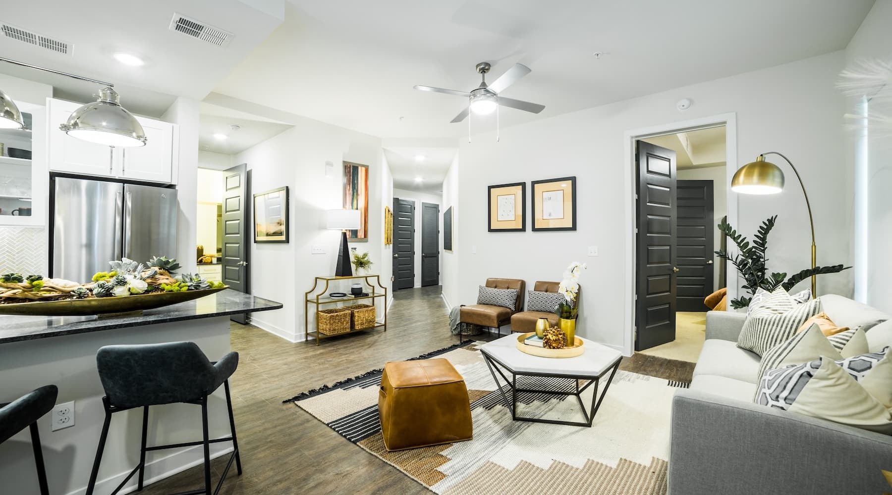 Model living room with kitchen view